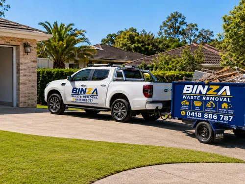 BINZA Waste Removal trailer parked in a driveway